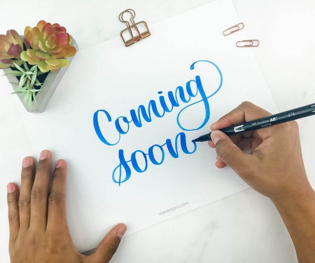 Coming soon brush calligraphy sign by Vial Designs