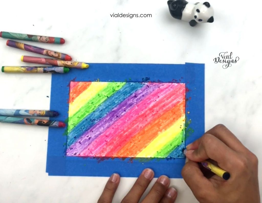 Paper covered with crayons rainbow colors_DIY scratch paper for lettering tutorial